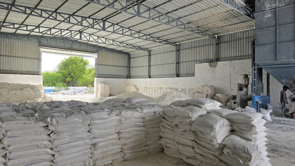Kaolin bags stacked in warehouse